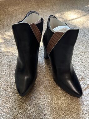 mark. Black Pointed-Toe Ankle Booties with Brown Ribbed Accent